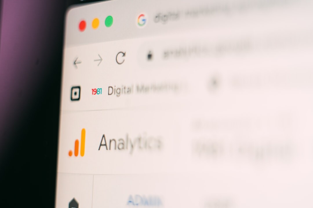 Laptop screen displaying digital marketing analytics dashboard with charts and graphs